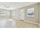 Neutral living room with tile flooring, ceiling fan and a large window at 4635 20Th S Ave, St Petersburg, FL 33711