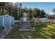 Beautiful backyard featuring a deck and lush landscaping at 5410 Tangerine Dr, Zephyrhills, FL 33542