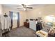 Bedroom with neutral walls, carpet, and a computer desk at 5410 Tangerine Dr, Zephyrhills, FL 33542