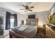 Comfortable bedroom with a dark fan and modern decor at 5410 Tangerine Dr, Zephyrhills, FL 33542