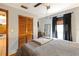Bedroom featuring a closet, dark curtains, and view of a television at 5410 Tangerine Dr, Zephyrhills, FL 33542