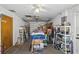 Garage filled with shelves, boxes, and other miscelleanous items at 5410 Tangerine Dr, Zephyrhills, FL 33542