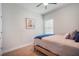 Simple bedroom with a twin bed, neutral carpet, and a window with blinds at 5566 Silver Sun Dr, Apollo Beach, FL 33572