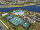 Aerial shot showcases the community's amenities, including tennis and basketball courts, a pool, and a clubhouse at 5566 Silver Sun Dr, Apollo Beach, FL 33572