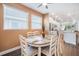 Dining area with natural light and views into the kitchen and Gathering rooms at 5566 Silver Sun Dr, Apollo Beach, FL 33572