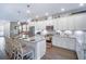 Modern, open kitchen with granite counters, stainless appliances, and lots of counter seating at 5566 Silver Sun Dr, Apollo Beach, FL 33572