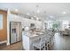 Modern kitchen featuring white cabinets, granite countertops and stainless steel appliances at 5566 Silver Sun Dr, Apollo Beach, FL 33572