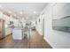 Spacious open concept living space featuring kitchen island, dining area, and Gathering room at 5566 Silver Sun Dr, Apollo Beach, FL 33572