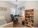 Bright home office featuring a desk, chair, personal decorations, and a comfortable daybed at 5566 Silver Sun Dr, Apollo Beach, FL 33572