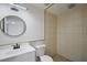 Bathroom with a modern mirror, walk-in shower, and white vanity at 6160 Van Dine St, Englewood, FL 34224