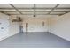 Spacious two-car garage featuring epoxy flooring, with ample room for storage and easy access to the home's interior at 6160 Van Dine St, Englewood, FL 34224