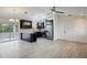 Open concept kitchen with stainless steel appliances, dark cabinets, light countertops and wood floors at 6160 Van Dine St, Englewood, FL 34224