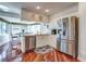 A kitchen featuring white cabinets and stainless steel appliances at 7009 Greenbrier Dr, Seminole, FL 33777