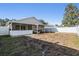 Large fenced-in backyard with covered patio perfect for outdoor entertaining at 7911 Floradora Dr, New Port Richey, FL 34654