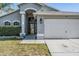Close up of a charming single-story home with a well-maintained lawn at 7911 Floradora Dr, New Port Richey, FL 34654