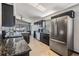 Modern kitchen featuring granite countertops and stainless steel appliances at 7911 Floradora Dr, New Port Richey, FL 34654