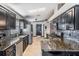 Bright kitchen with stainless steel appliances, granite countertops, dark cabinets and lots of natural light at 7911 Floradora Dr, New Port Richey, FL 34654