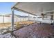 Covered patio with brick flooring and views of the backyard and fencing at 7911 Floradora Dr, New Port Richey, FL 34654