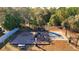 Community playground with swings, slide, and a basketball court for active play at 7911 Floradora Dr, New Port Richey, FL 34654
