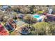 Aerial shot of the pool, shuffleboard, playground, and community amenities at 8024 Feather Ct # D, Hudson, FL 34667
