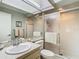 Clean and well-maintained bathroom featuring a shower, sink, and mirrored vanity at 8024 Feather Ct # D, Hudson, FL 34667