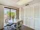 Bright dining area featuring a table, chairs, and a view to the outdoors at 8024 Feather Ct # D, Hudson, FL 34667