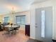 Chandelier lit dining room with a large window at 8024 Feather Ct # D, Hudson, FL 34667
