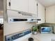 Kitchen with range hood, stainless steel microwave, and ample counter space at 8024 Feather Ct # D, Hudson, FL 34667