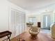 Open-concept living room with views of the dining area, front door, and closet doors at 8024 Feather Ct # D, Hudson, FL 34667