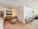 Cozy living room with ceiling fan, neutral-toned furniture, and nautical-themed artwork on the walls at 8024 Feather Ct # D, Hudson, FL 34667