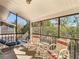 Enjoy the outdoors on this screened porch with ample seating and peaceful views at 8024 Feather Ct # D, Hudson, FL 34667