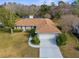 Lovely single-Gathering home with a spacious yard, mature trees, and a two-car garage at 8701 Braxton Dr, Hudson, FL 34667