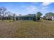 Backyard with lush greenery, perfect for outdoor activities, relaxation, and enjoying nature at 8701 Braxton Dr, Hudson, FL 34667