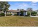 Well-maintained single-Gathering home featuring a beautifully landscaped front yard and a welcoming entrance at 8701 Braxton Dr, Hudson, FL 34667