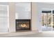 Close-up of the fireplace showcasing the brick surround, glass doors, and access to the back at 8701 Braxton Dr, Hudson, FL 34667