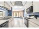 Open concept kitchen and breakfast nook with a view to the backyard at 8701 Braxton Dr, Hudson, FL 34667