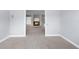 Spacious, open-concept living room with fireplace and neutral-colored walls and carpet at 8701 Braxton Dr, Hudson, FL 34667