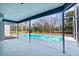 Screened-in pool area, offering a relaxing outdoor space with views of the surrounding greenery at 8701 Braxton Dr, Hudson, FL 34667