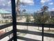 View from a screened porch showcases landscaping, beach and the Gulf beyond at 9620 Pieces Of Eight Trl, Placida, FL 33946