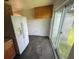 Kitchen featuring a white refrigerator and sliding glass door to the backyard at 9707 Lithia Pinecrest Rd, Lithia, FL 33547
