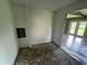 An unfinished room with peeling floors awaits transformation at 9707 Lithia Pinecrest Rd, Lithia, FL 33547