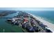 Stunning aerial view of beachfront property with ocean views and convenient access to nearby shops and restaurants at 9895 1St E St # 5, Treasure Island, FL 33706