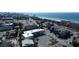 A high-angle view of an apartment complex near a beach with a great view of the city skyline at 9895 1St E St # 5, Treasure Island, FL 33706
