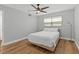 Bedroom with a ceiling fan and a lamp at 9895 1St E St # 5, Treasure Island, FL 33706
