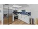Updated kitchen with stainless steel appliances, modern cabinets, and stylish backsplash at 9895 1St E St # 5, Treasure Island, FL 33706