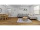 Bright living room featuring modern decor, light flooring, and comfortable seating at 9895 1St E St # 5, Treasure Island, FL 33706