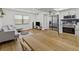 Open living area with a modern kitchen, dining table, and comfortable seating at 9895 1St E St # 5, Treasure Island, FL 33706