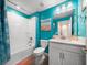 Bathroom featuring a shower tub combo and stylish decor at 17308 Holly Well Ave, Wimauma, FL 33598