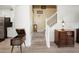 Inviting entryway featuring classic decor and a staircase leading to the upper level at 17308 Holly Well Ave, Wimauma, FL 33598