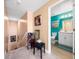 Upstairs hallway with unique decor leading to a full bathroom at 17308 Holly Well Ave, Wimauma, FL 33598
